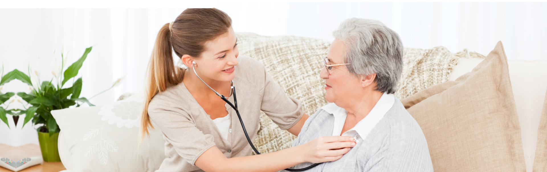 A caregiver examining an elderly